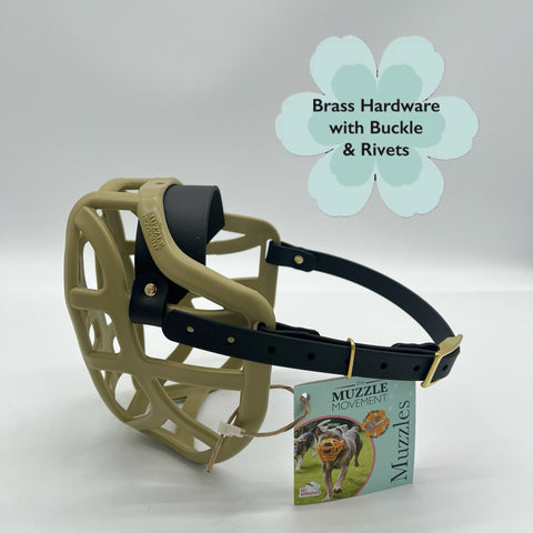 Dog muzzle with brass hardware and buckle on a white background