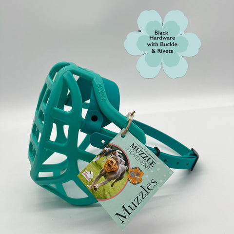 The Muzzle Movement Teal dog muzzle with a tag 