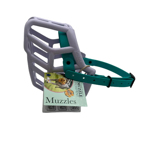 The Muzzle Movement lilac rex dog muzzle with teal straps and black hardware on a white background
