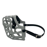 The Muzzle Movement Grey Taz Dog Muzzle with black straps and nickle chicago screws on a white background