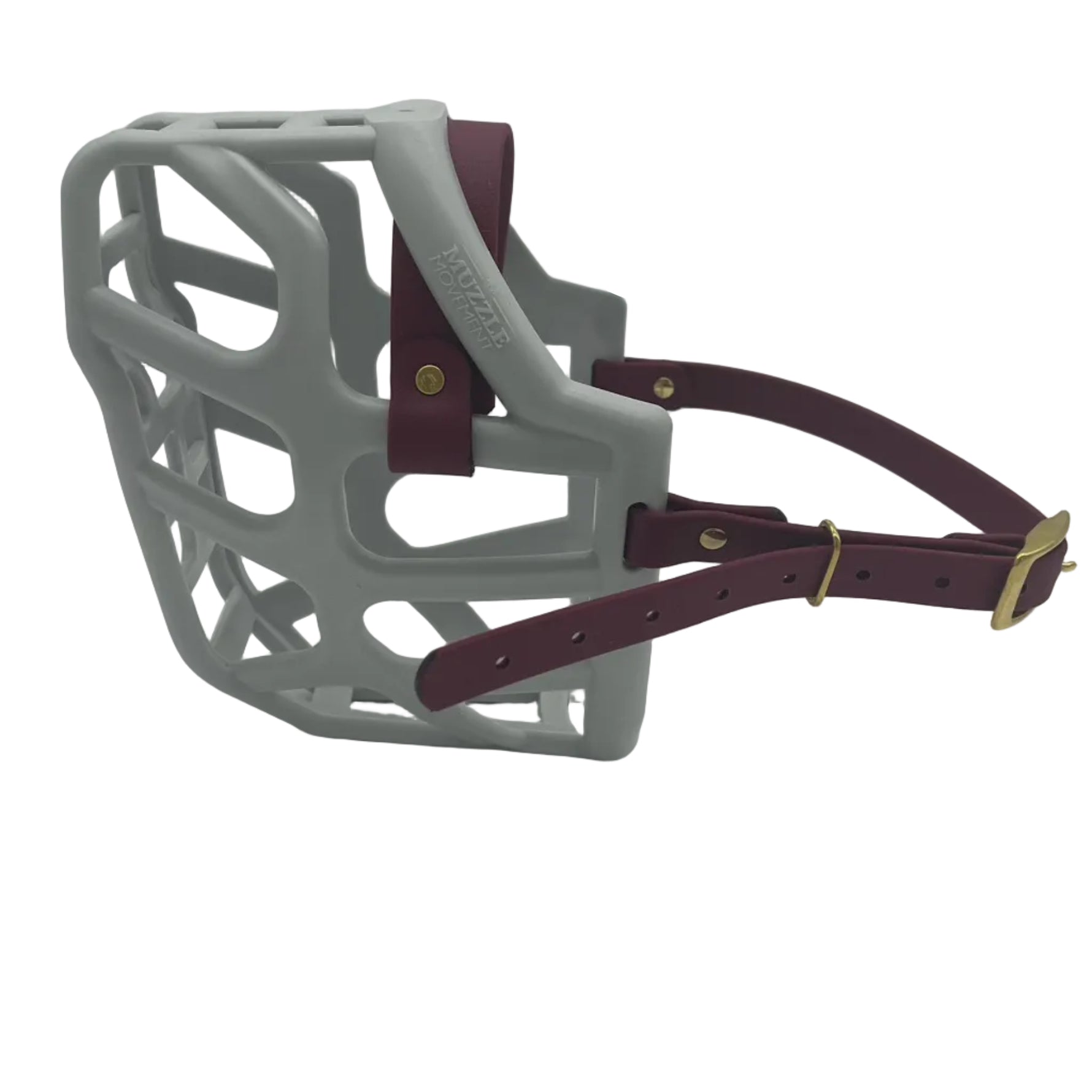 The Muzzle Movement Grey Taz dog muzzle with wine straps and brass hardware on a white background