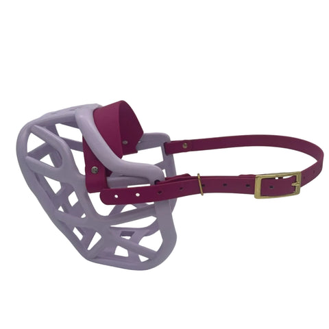 The Muzzle Movement Lilac Harry 2.0 dog muzzle with magenta pink straps and brass hardware on a white background