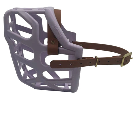 The Muzzle Movement Lilac Taz dog muzzle with light brown straps and brass hardware on a white background