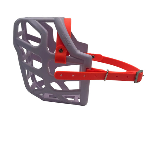 The Muzzle Movement Lilac Taz dog muzzle with orange straps and nickle hardware on a white background
