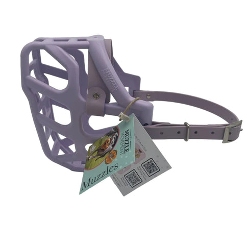 The Muzzle Movement Lilac Taz dog muzzle with pastel purple straps and nickle hardware on a white background