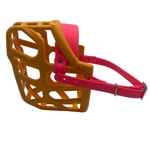 The Muzzle Movement Orange Taz* Dog muzzle with neon pink straps and nickle hardware on a white background