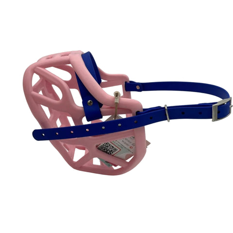 The Muzzle Movement Pastel Pink Harry 2.0 dog muzzle with dark blue straps and nickle hardware on a white background