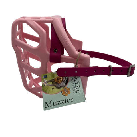 The Muzzle Movement Pastel Pink Taz dog muzzle with magenta pink straps and nickle hardware on a white background