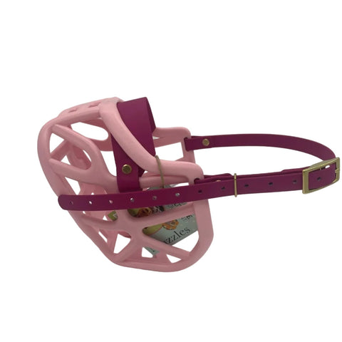 The Muzzle Movement Pastel pink Harry* 2.0 dog muzzle with magenta pink straps and brass hardware on a white background