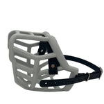 The Muzzle Movement grey tolly dog muzzle with black straps, nickle hardware and chicago screws on a white background