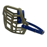 The Muzzle Movement khaki Neli* dog muzzle with dark blue straps and brass hardware on a white background