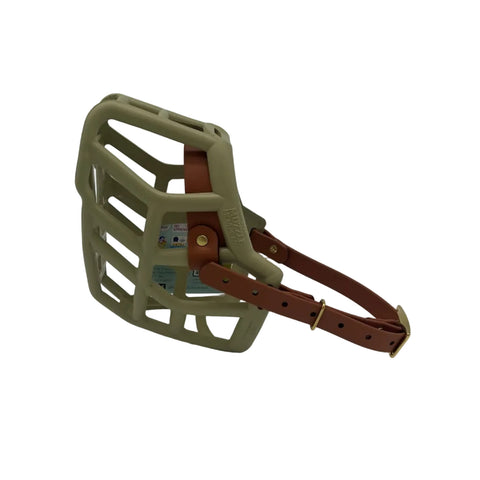 The Muzzle Movement khaki green rex dog muzzle with light brown straps and brass hardware on a white background
