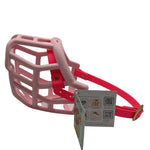 The Muzzle Movement pastel pink Tolly dog muzzle with neon pink straps and brass hardware on a white background