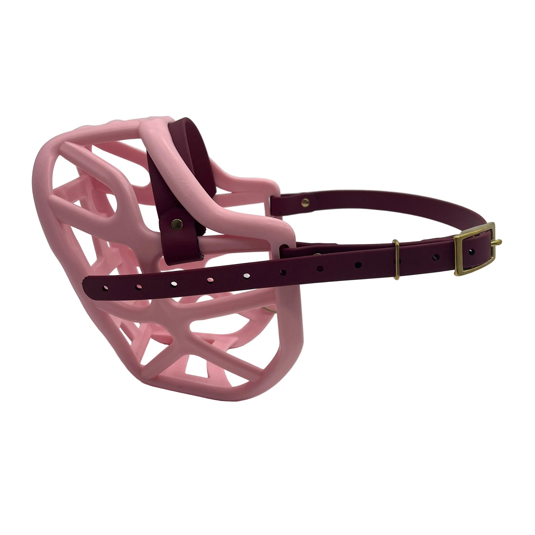 The Muzzle Movement pastel pink harry 2.0 dog muzzle with wine straps and brass hardware