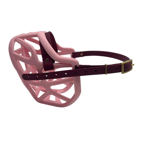 The Muzzle Movement pastel pink harry 2.0 dog muzzle with wine straps and brass hardware