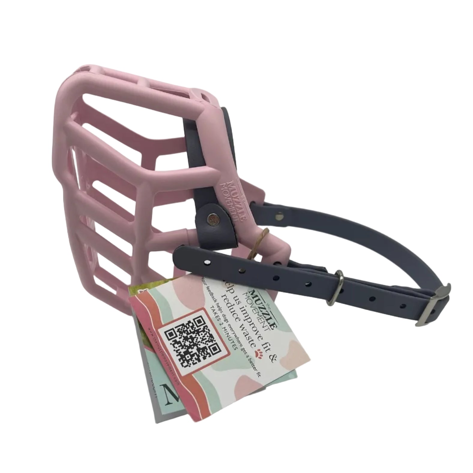 The Muzzle Movement pastel pink rex dog muzzle with grey straps and nickle hardware on a white background