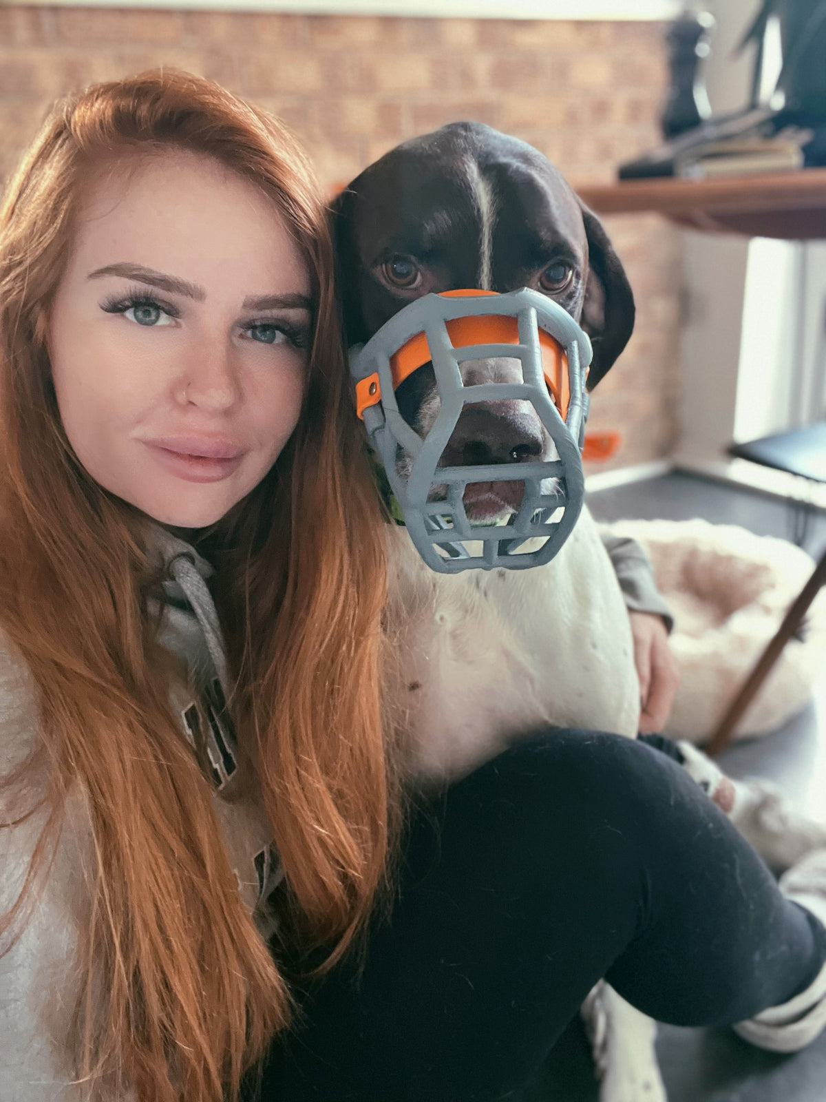 Clara with Tolly wearing a grey muzzle